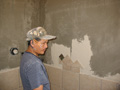 Tilesetter installing owner tile design