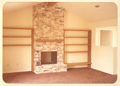 Fireplace and cedar bookshelves at 8214 Argentina