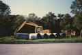 Moving storm sewer pipes into position