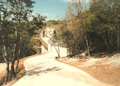 Driveway entrance to Austin home on side of hill